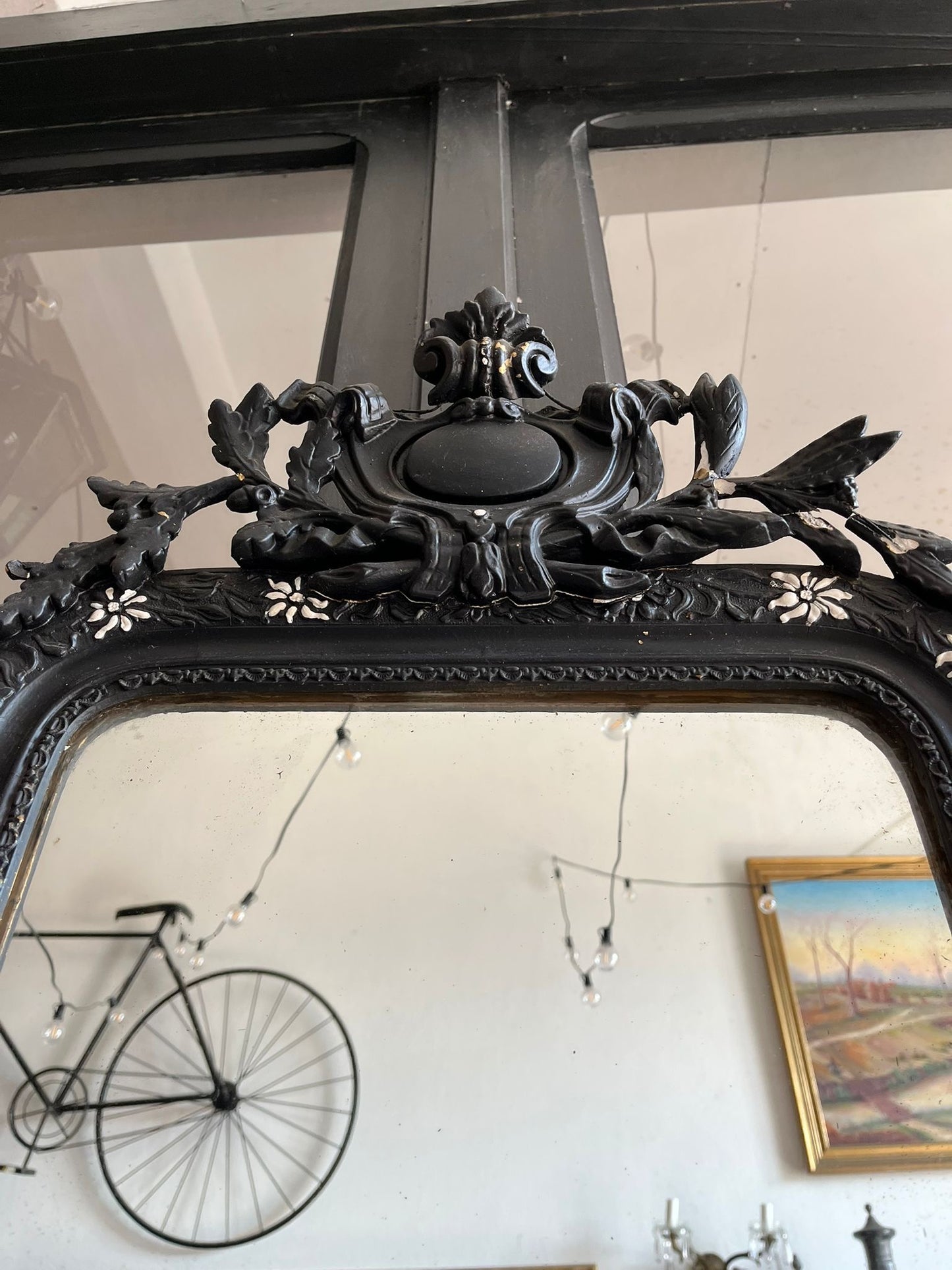 Miroir Napoléon III en bois noirci à décor floral incrusté