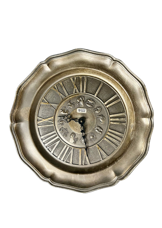 Horloge murale en étain