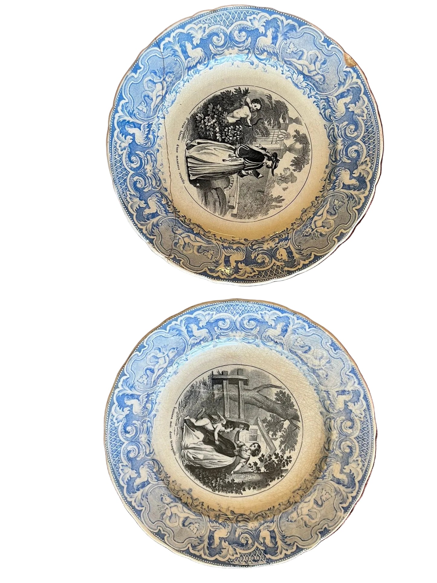 Paire d’assiettes parlantes terre de fer XIXe décor amoureux bleu