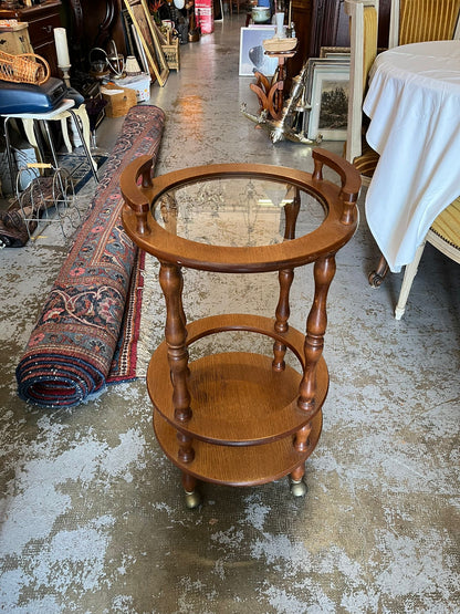 Desserte roulante ronde en bois avec plateau en verre